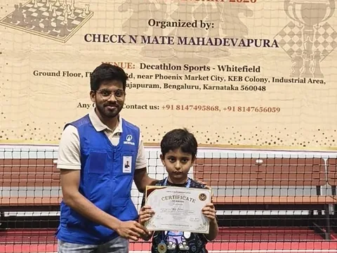 Kabir receiving a certificate from an organiser at a one-day rapid tournament